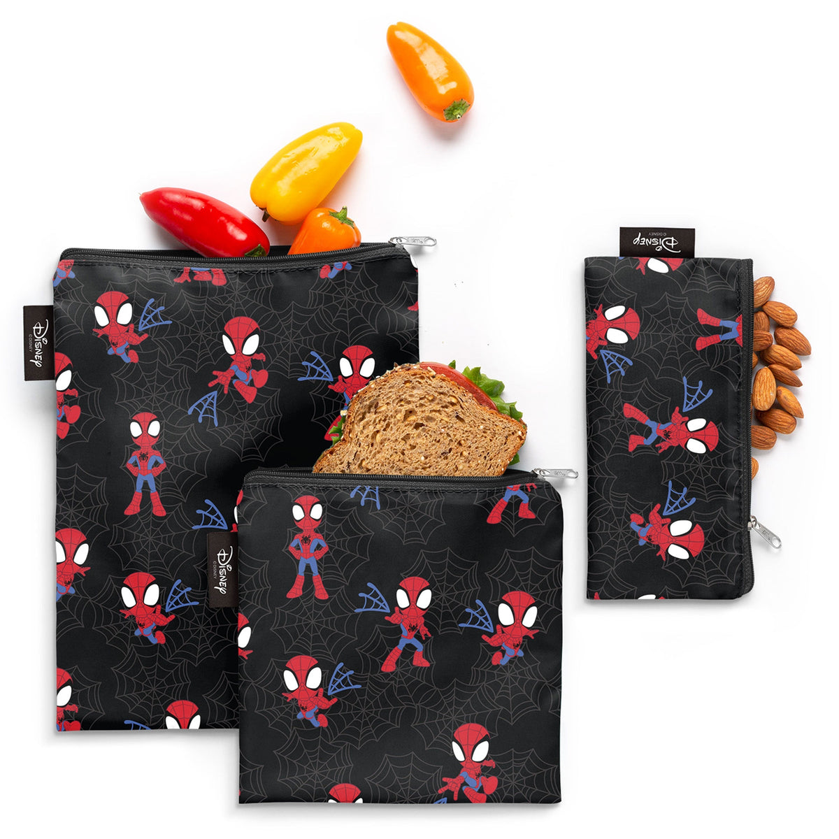 Three black Spider-Man kids lunch bags featuring vibrant red, white, and blue Spider-Man designs with fresh food props displayed.