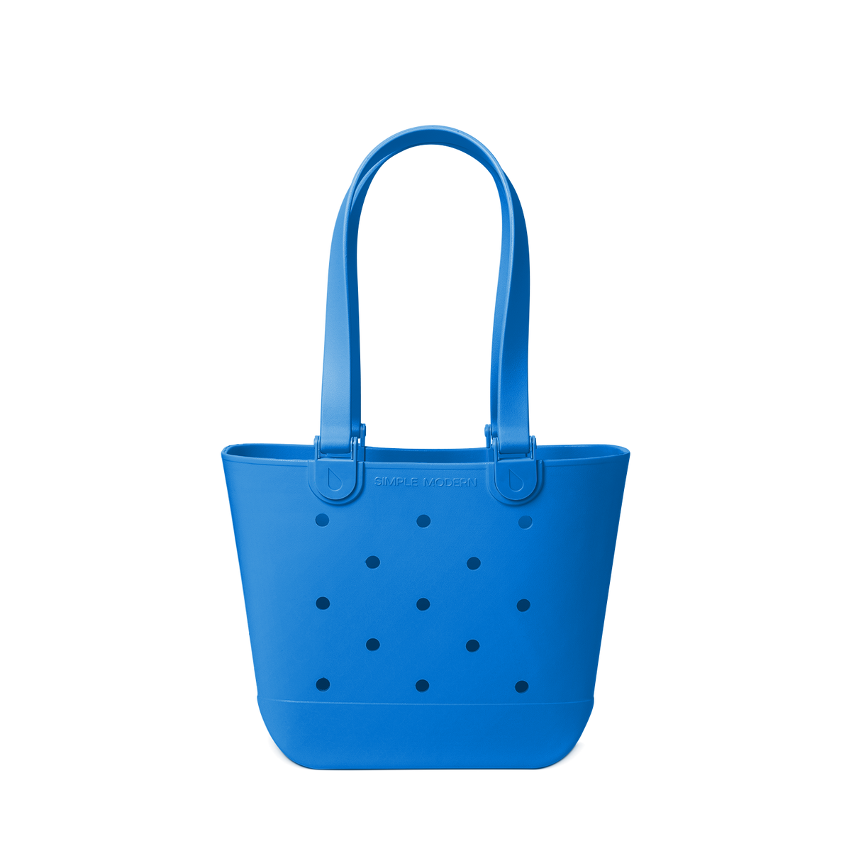 Royal blue tote bag with navy polka dots on off-white background