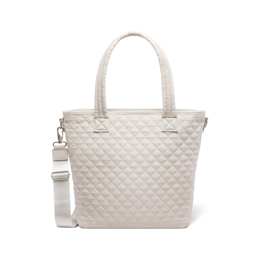 Cream-colored canvas tote bag displayed against white background, front view showing simple, minimalist design with neutral beige tone and clean aesthetic.