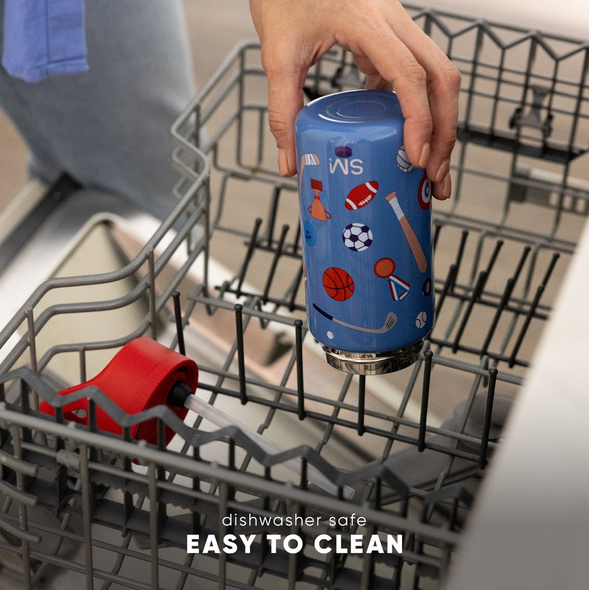 Blue Simple Modern Kids Summit 2.0 water bottle with sports design being placed in a dishwasher rack, demonstrating dishwasher-safe functionality for easy cleaning.