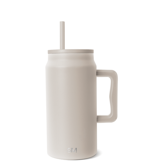 Cream-colored insulated tumbler with beige lid, handle, and matching straw