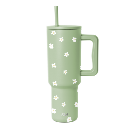 Soft sage green tumbler with white floral design accent